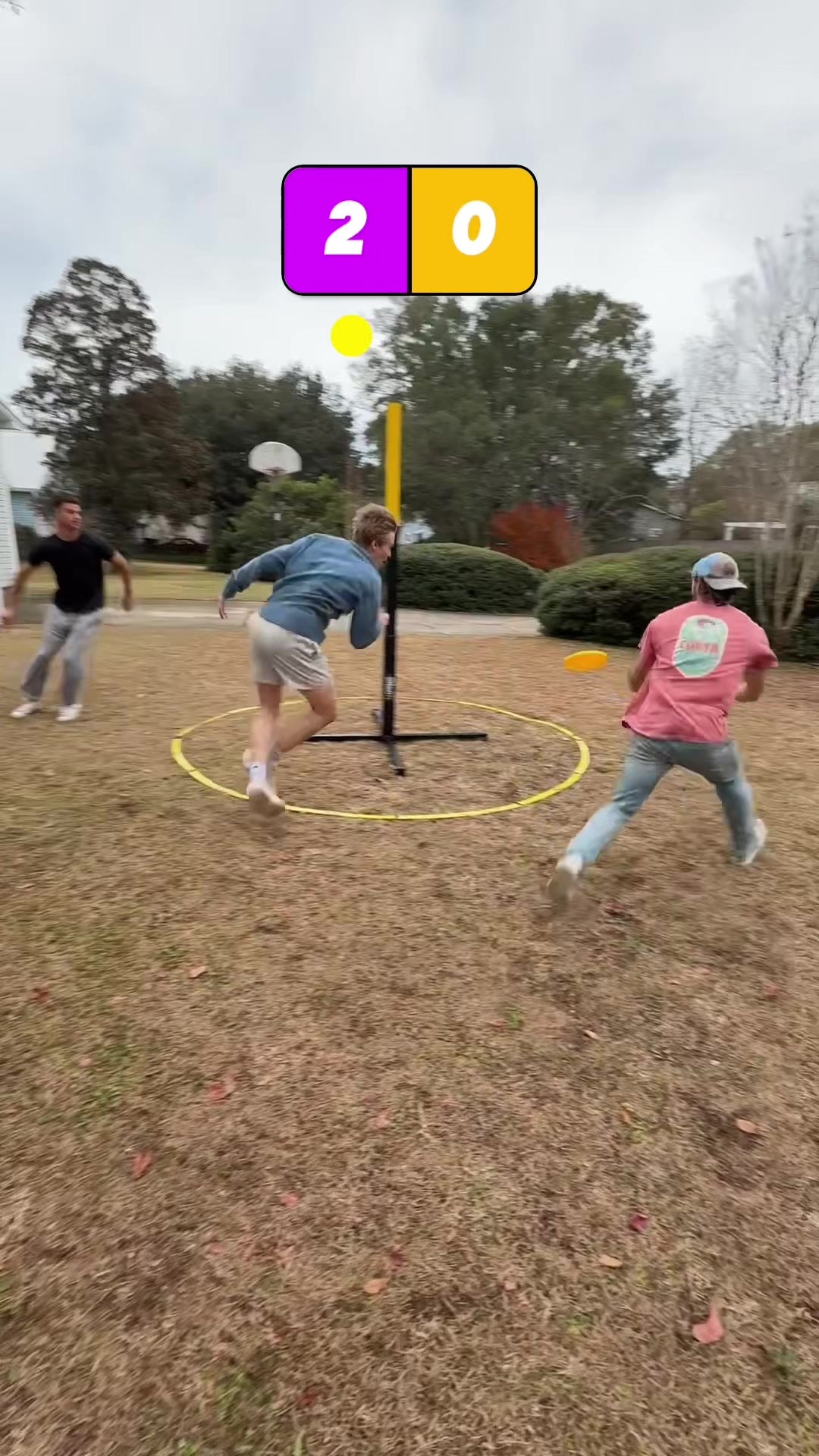 Players enjoying a team disc game outdoors